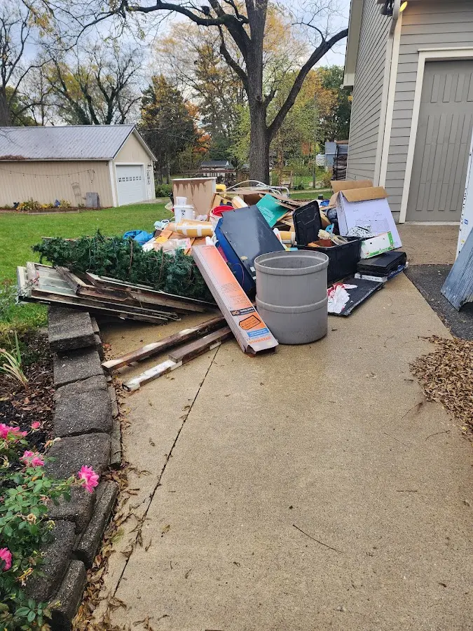 Dumpster being loaded with debris for Demolition Dumpster Rental in Blanchester